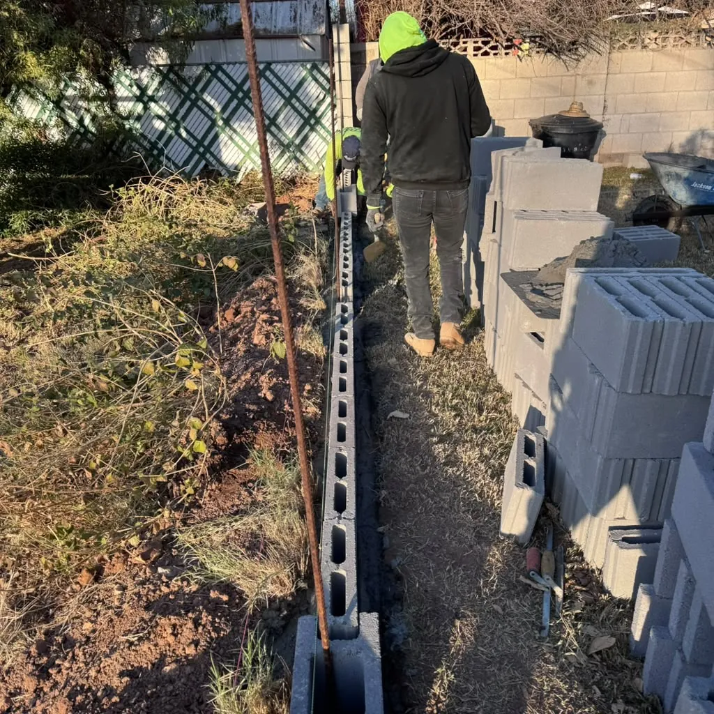 Trenching a new irrigation line through the side yard