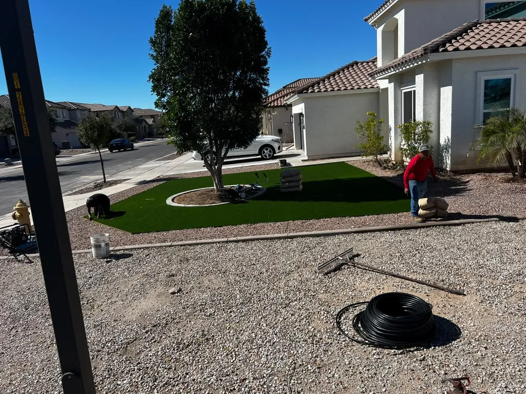 Front yard finished — turf, rock and a clean border