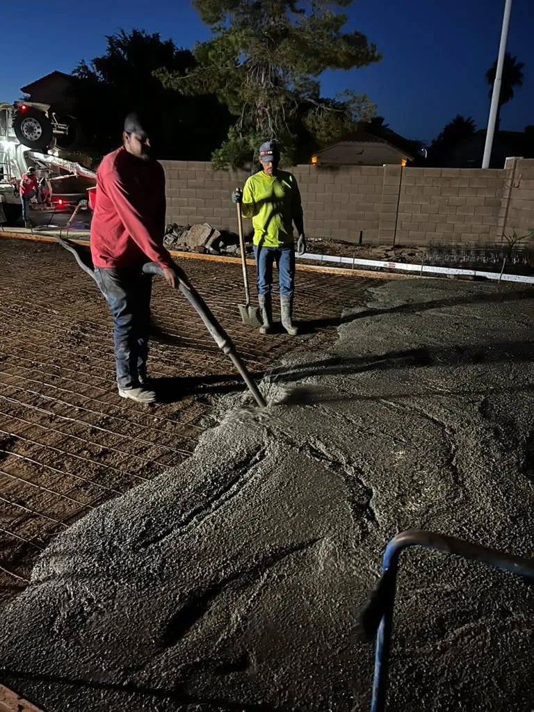 Power trowel finishing a fresh pour