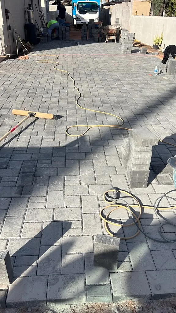 Wide paver driveway laid in a running bond